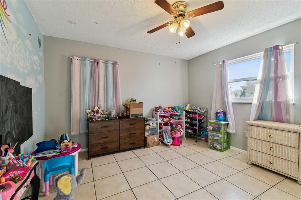 Bedroom with walk-in closet.