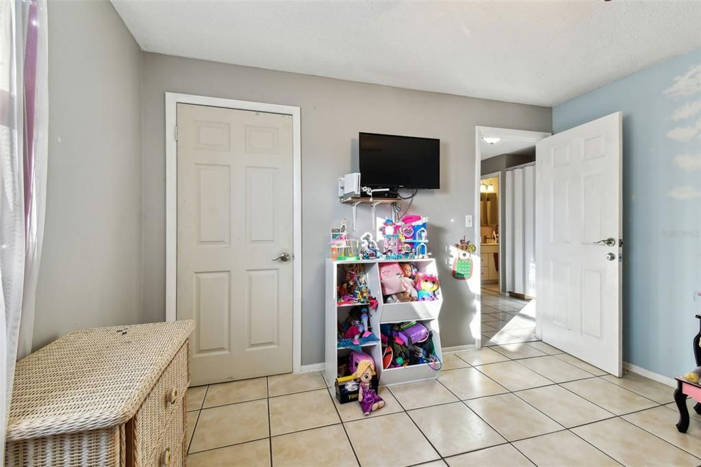 Bedroom with walk-in closet.