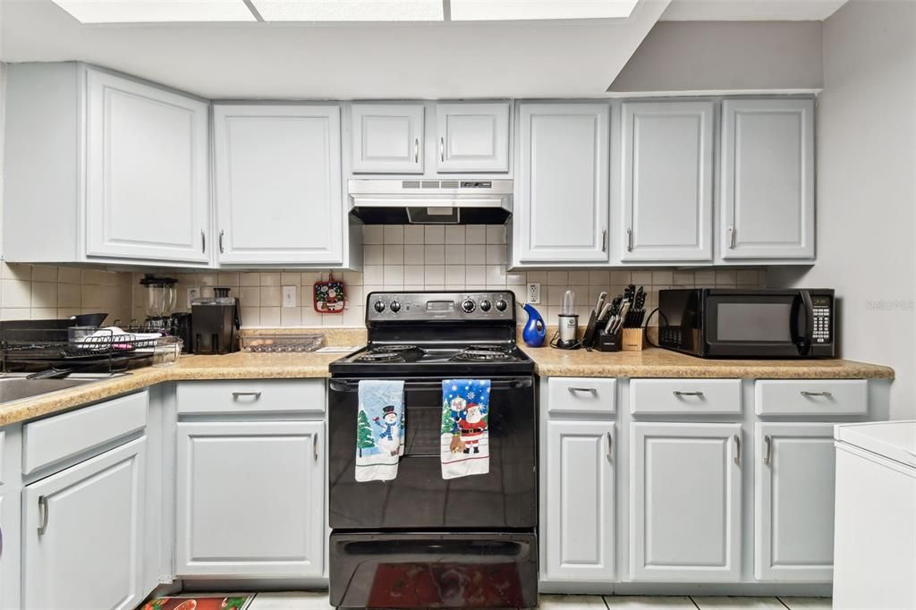 Kitchen with tiled flooring.