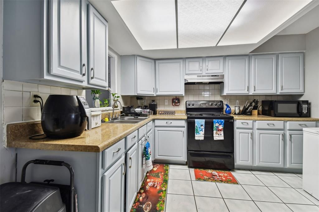 Kitchen view with resurfaced counters.