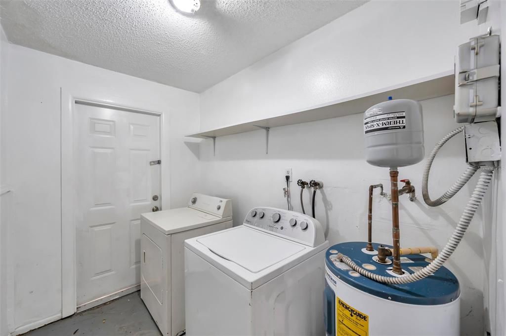 Inside utility room with washer and dryer.