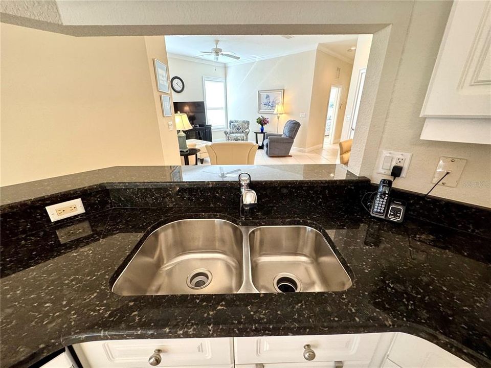 View of the living room from the kitchen sink, perfect for entertaining