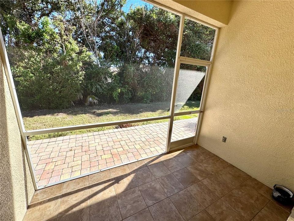 Rear patio overlooking a green space