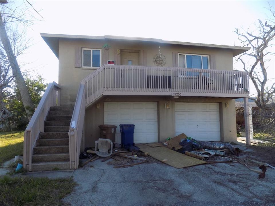 Rent out both units or live in one and rent the other. Each unit has it's own garage.