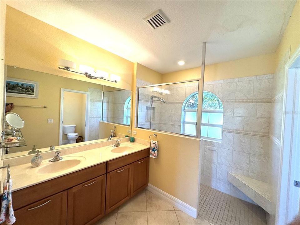 En-suite bathroom with dual sinks