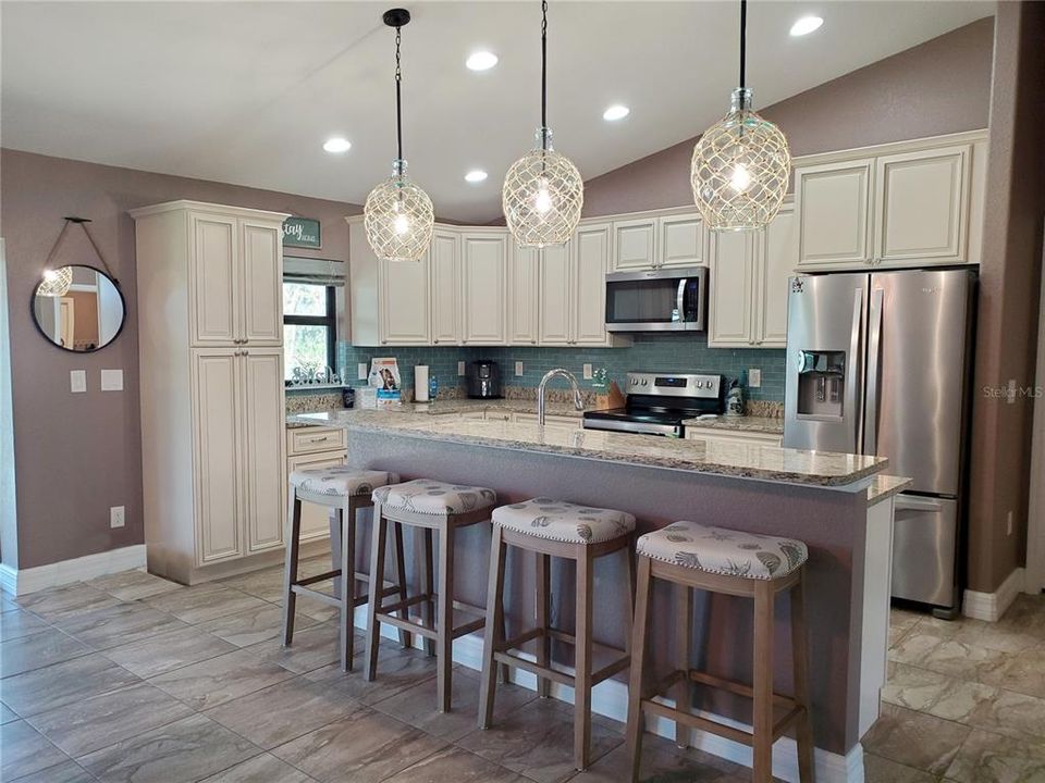 Open Floor Plan Kitchen with Granite Counters and Wood Cabinets