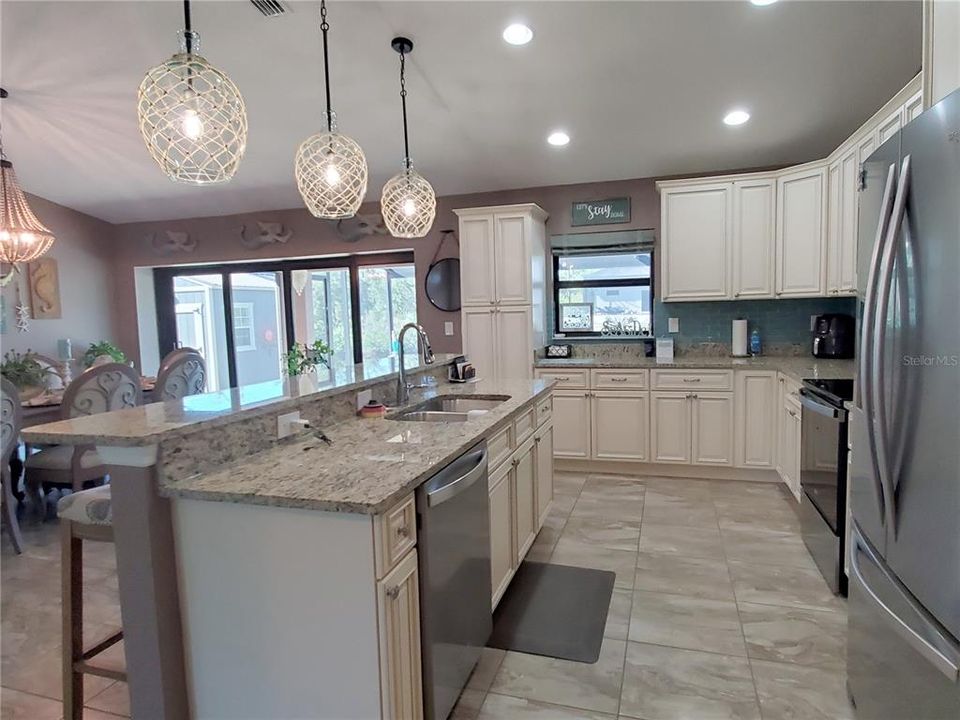 Open Floor Plan Kitchen with Granite Counters and Wood Cabinets