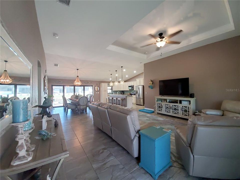 Open Floor Plan Great Room and Dining Room with Porcelain Tile Throughout the Entire Home