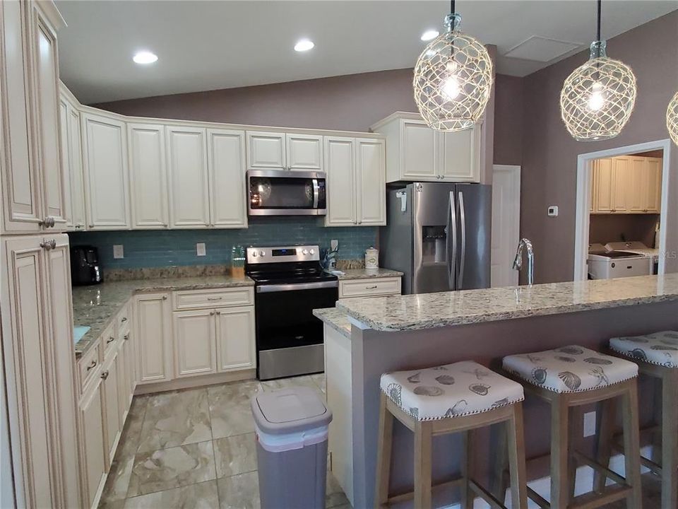 Open Floor Plan Kitchen with Granite Counters and Wood Cabinets