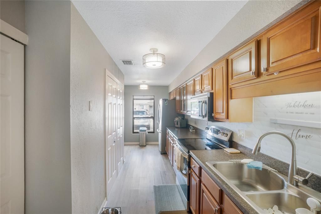 Extended updated kitchen with additional storage and cabinets (laundry in closet in picture)