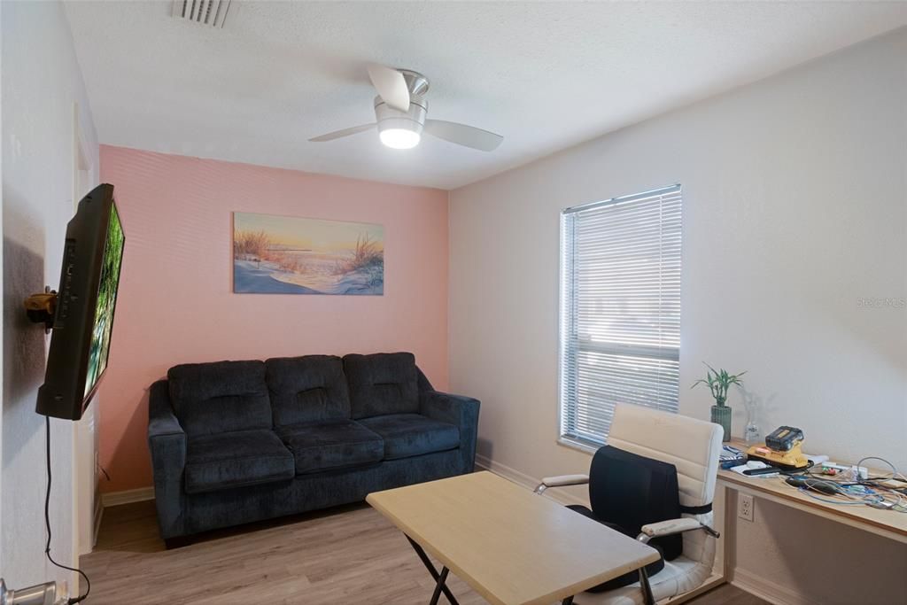 Bedroom 2 , updated floors with walk in closet and access to jack and jill full bathroom.