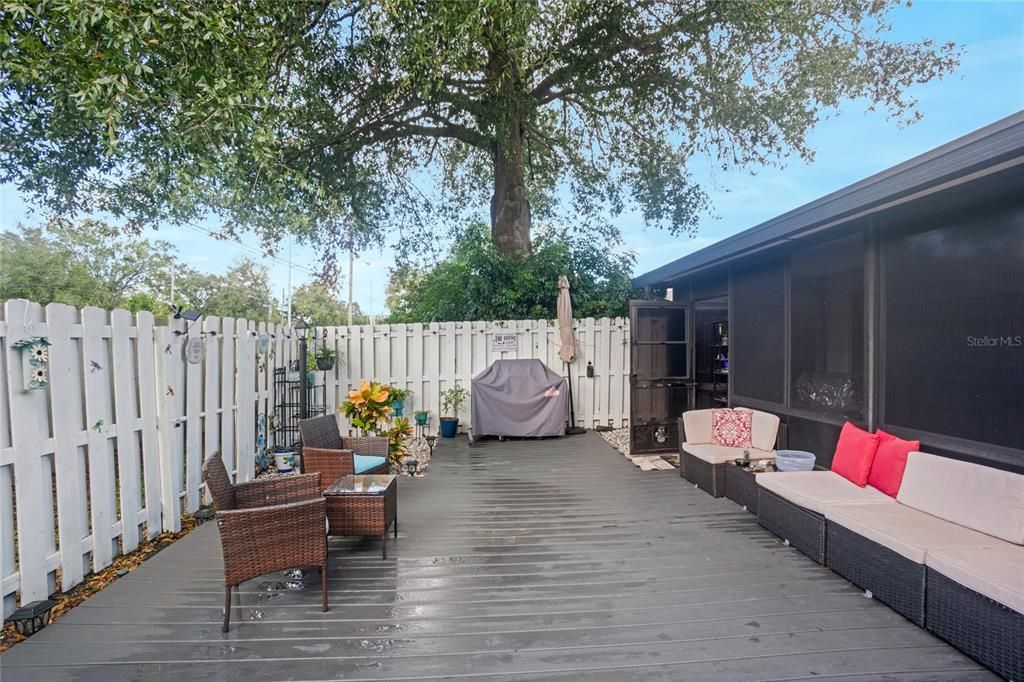 NEW outdoor private deck. Fresh painted white fence for privacy.