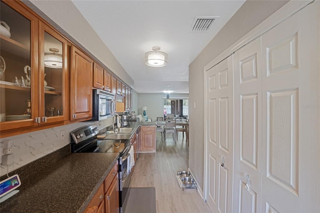 Extended updated kitchen with additional storage and cabinets. Updated luxury vinyl flooring throughout entire home.