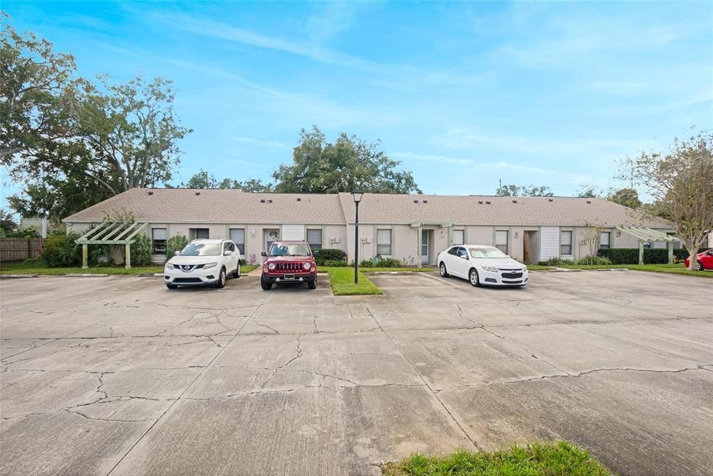 Exterior of Unit and two assigned parking + guest parking.