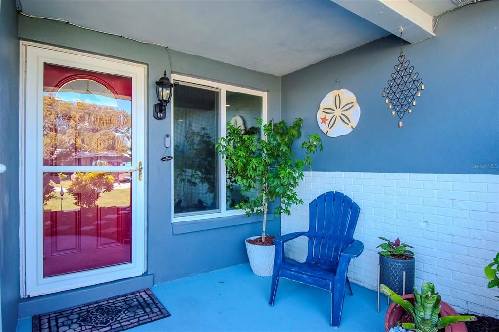 Front door entrance and walk up porch.