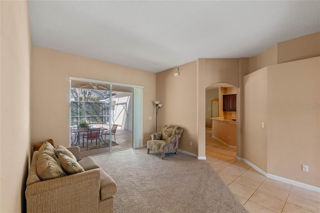 Formal living room. Sliders go the pool. Great use as a 2nd TV room.