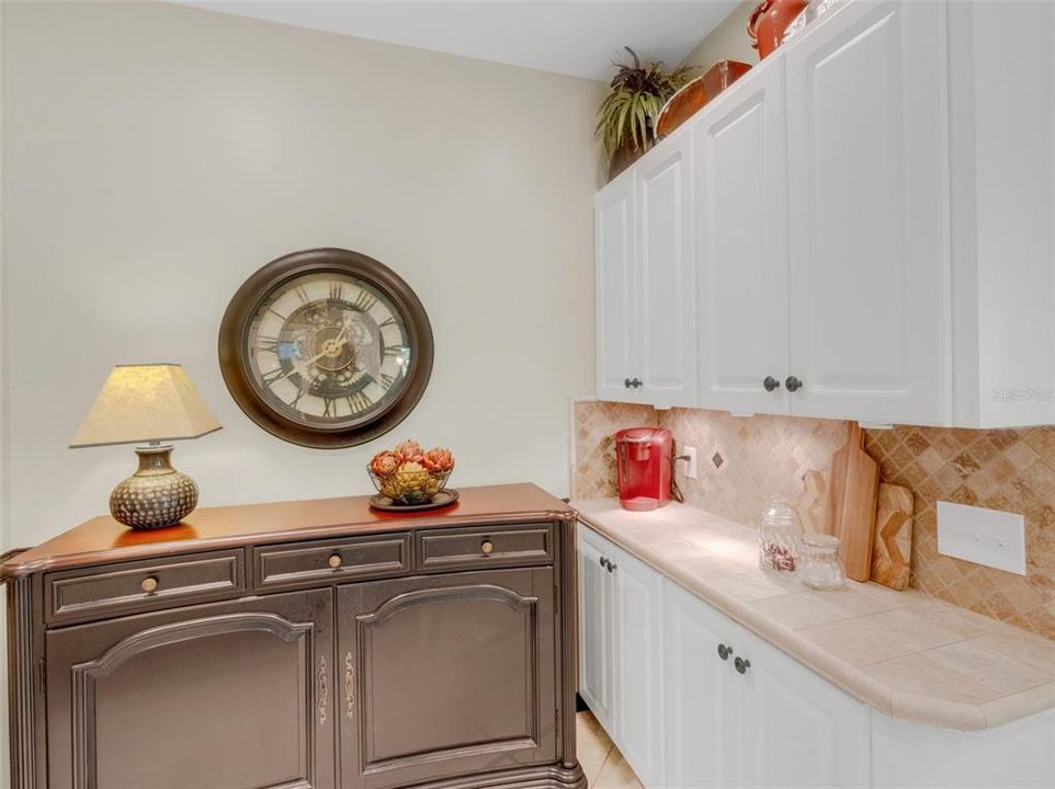 What was a small "eat-in" nook in the kitchen now boasts additional cabinets providing always welcome extra storage space.