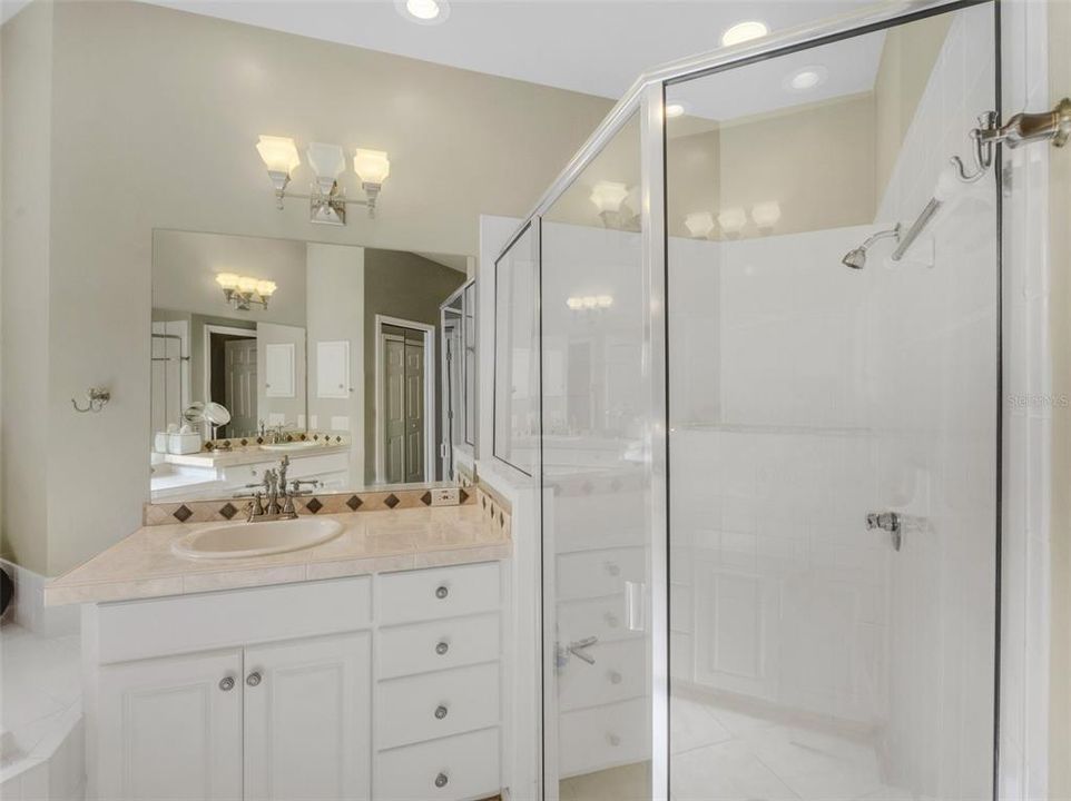 a large fully tiled walk-in shower.