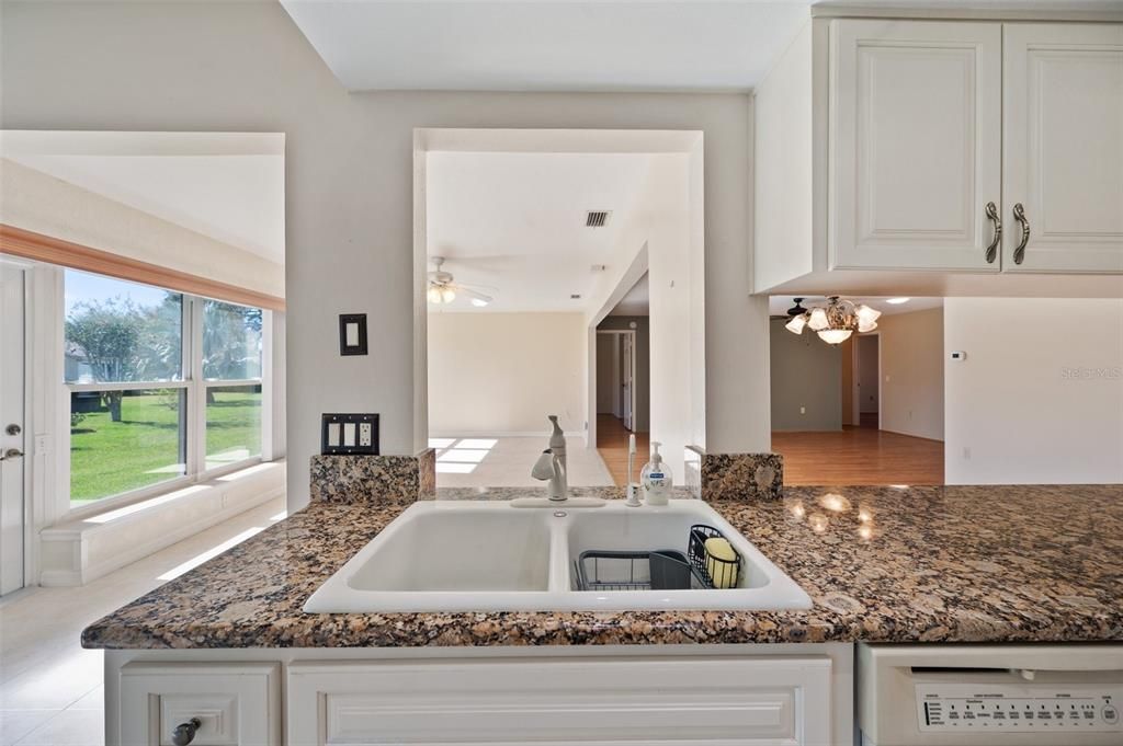 Showing pass thru areas of kitchen to family room and dining room