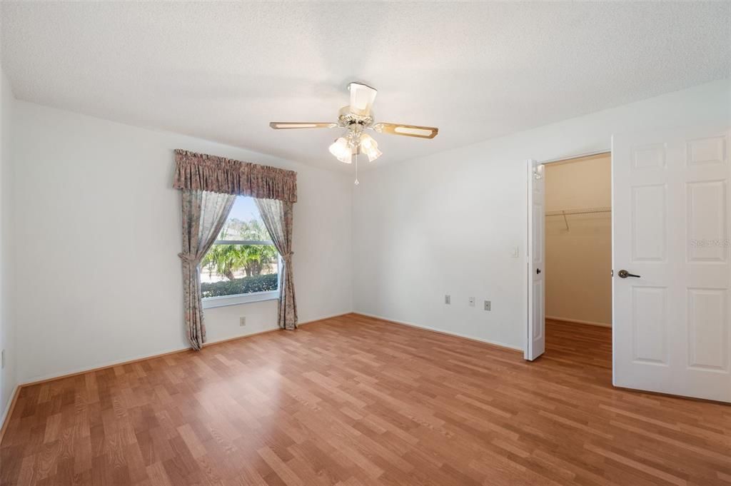 Guest bedroom showing large walk-in closet great for storage