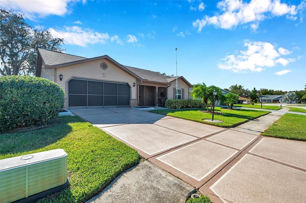 Decorative driveway enhances the property