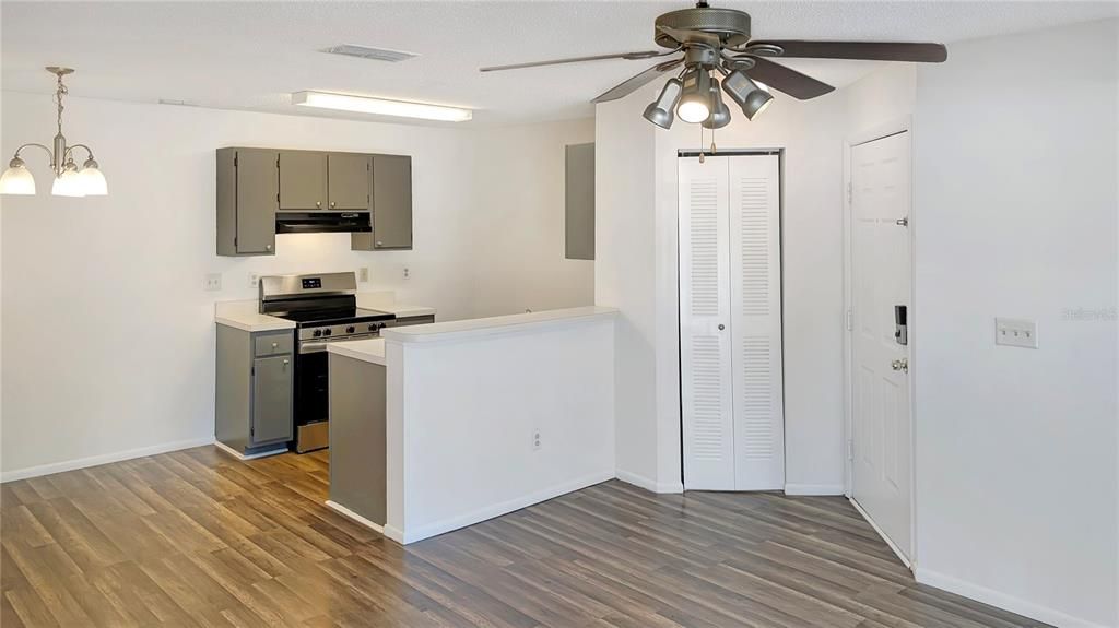 View of Kitchen and Dining Room as seen from Entry to Screened Porch and Living Room!  !  Be the First One to Ever Use Your NEW STOVE, NEW DISHWASHER, and NEW REFRIGERATOR too! Brand NEW WOOD FLOORING and FRESH PAINT