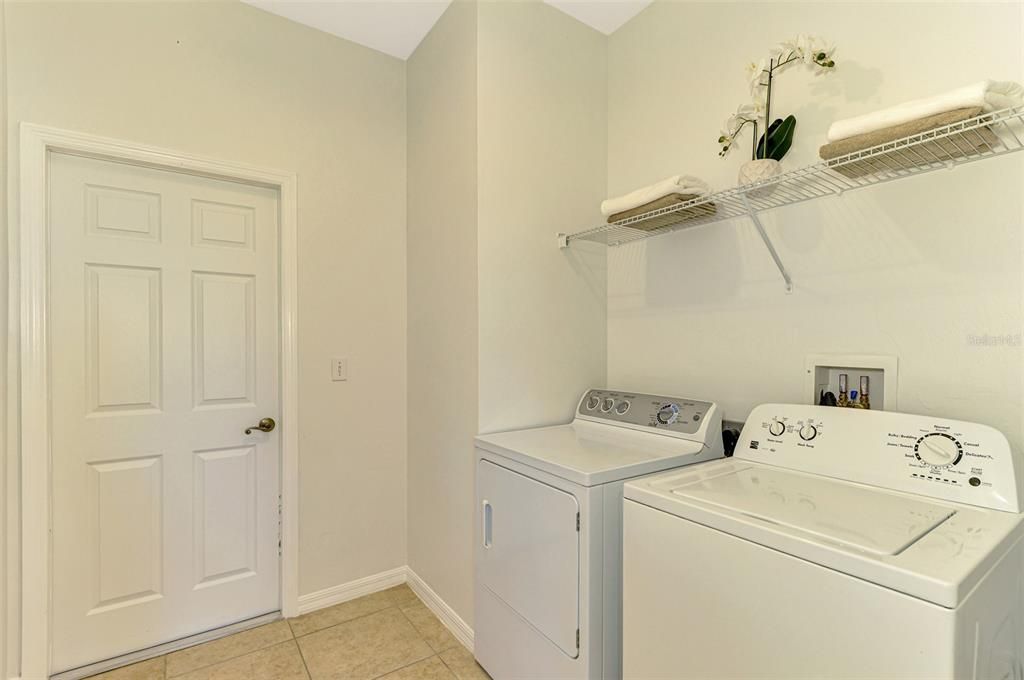 Laundry Room conveniently located in between the Kitchen and Garage