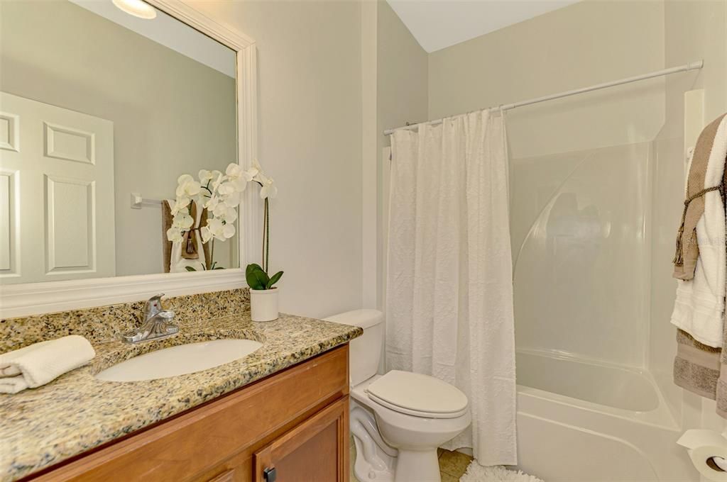 Guest Bath located in entry near the two guest bedrooms