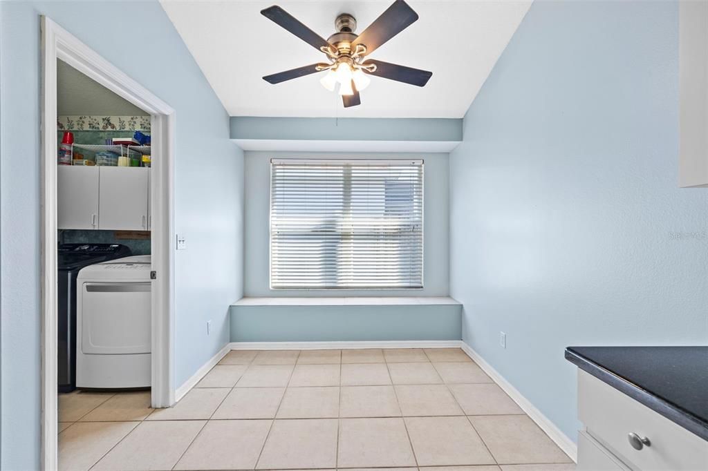 Kitchen breakfast nook with view of laundry room