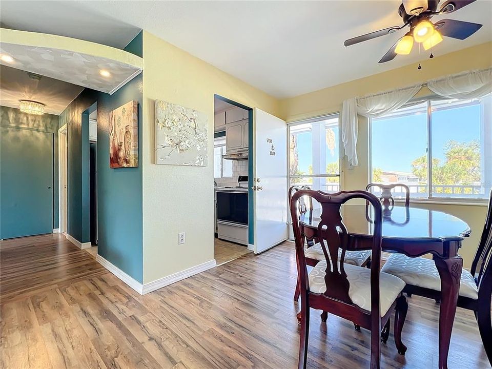 Wood laminate dining room, great room, and bedroom.