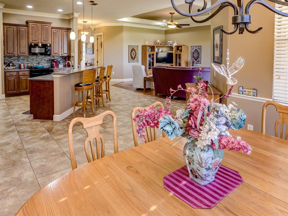 Dining room with the view of the kitchen and living room.