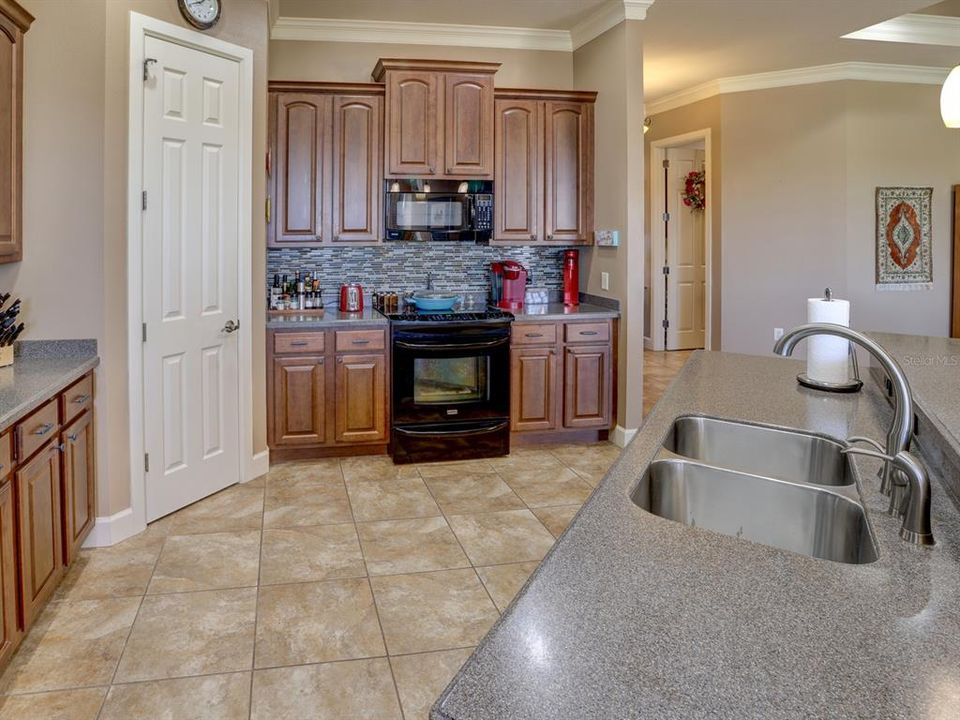 Kitchen. Hard surface countertops and wood