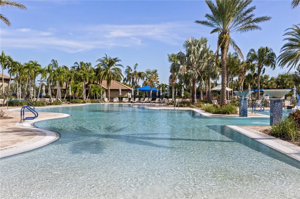 Community pool features a beach entry.