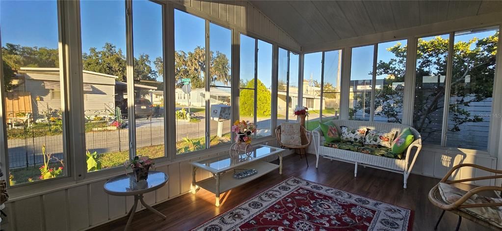 Entering the home through the glass enclosed Florida room