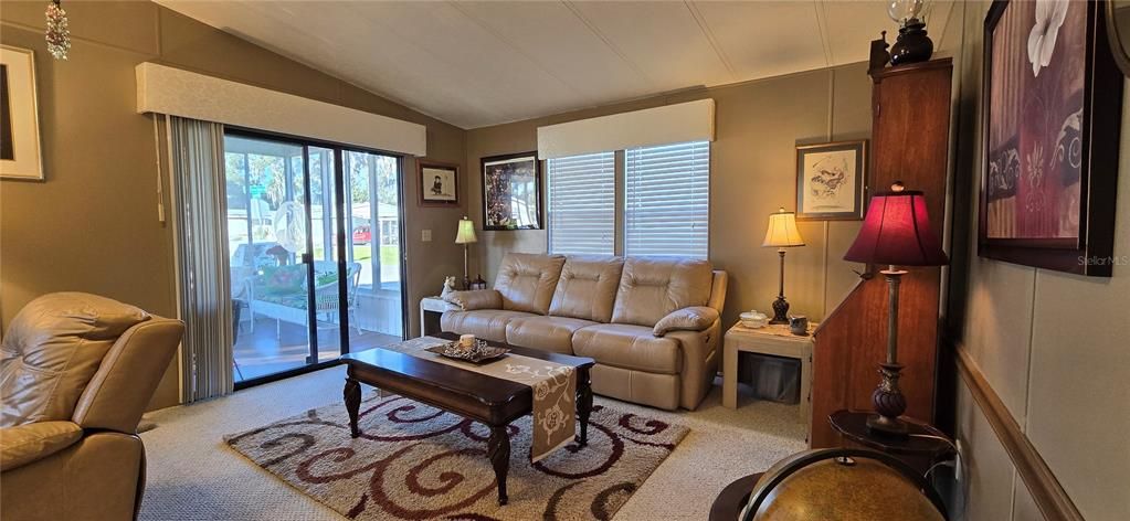 Living room entrance through sliding door from Florida room