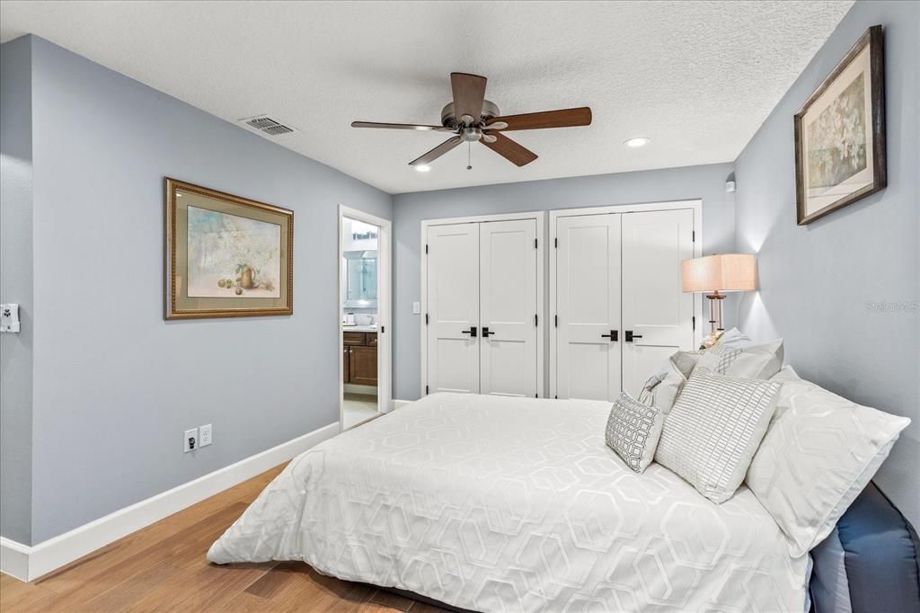 2nd bedroom with a wall of closets