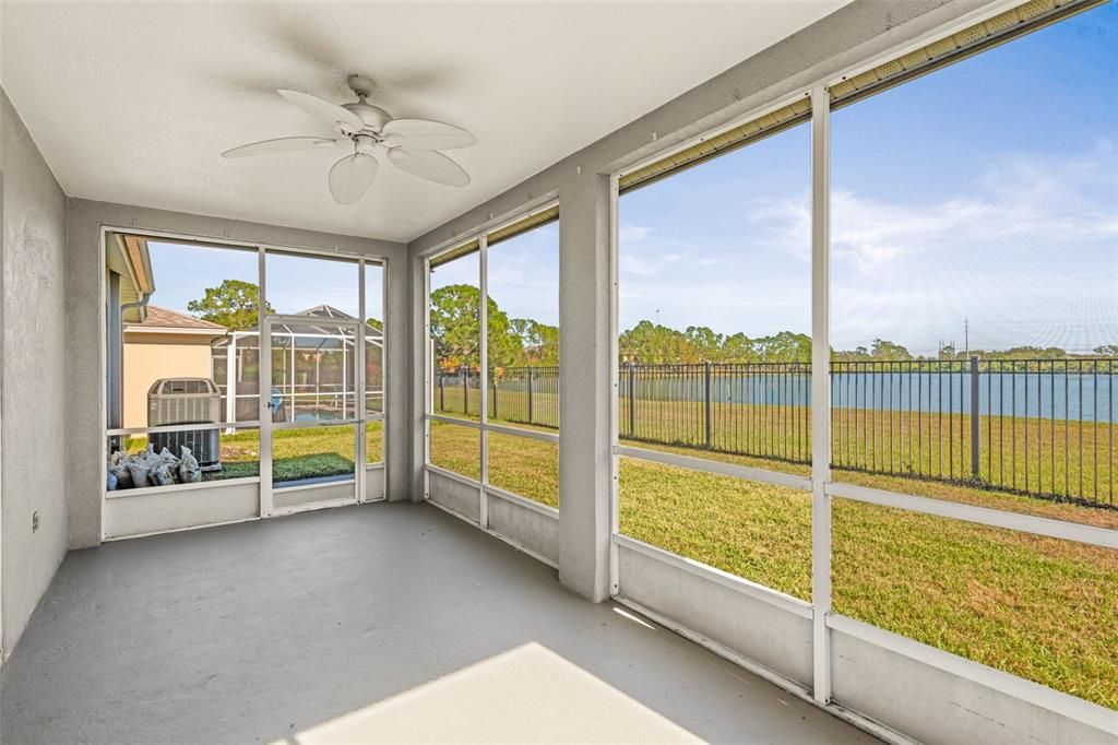 Large screened lanai with view of pond