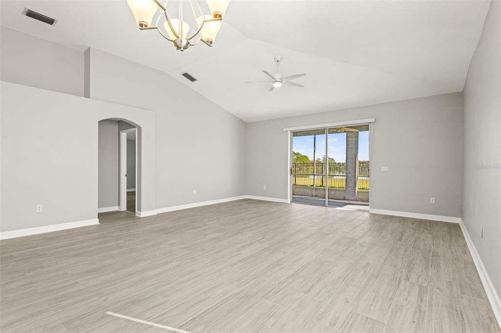 Living/dining combo with view to backyard and primary bedroom