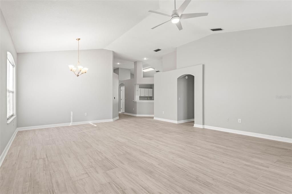 Living/dining combo space with view towards kitchen