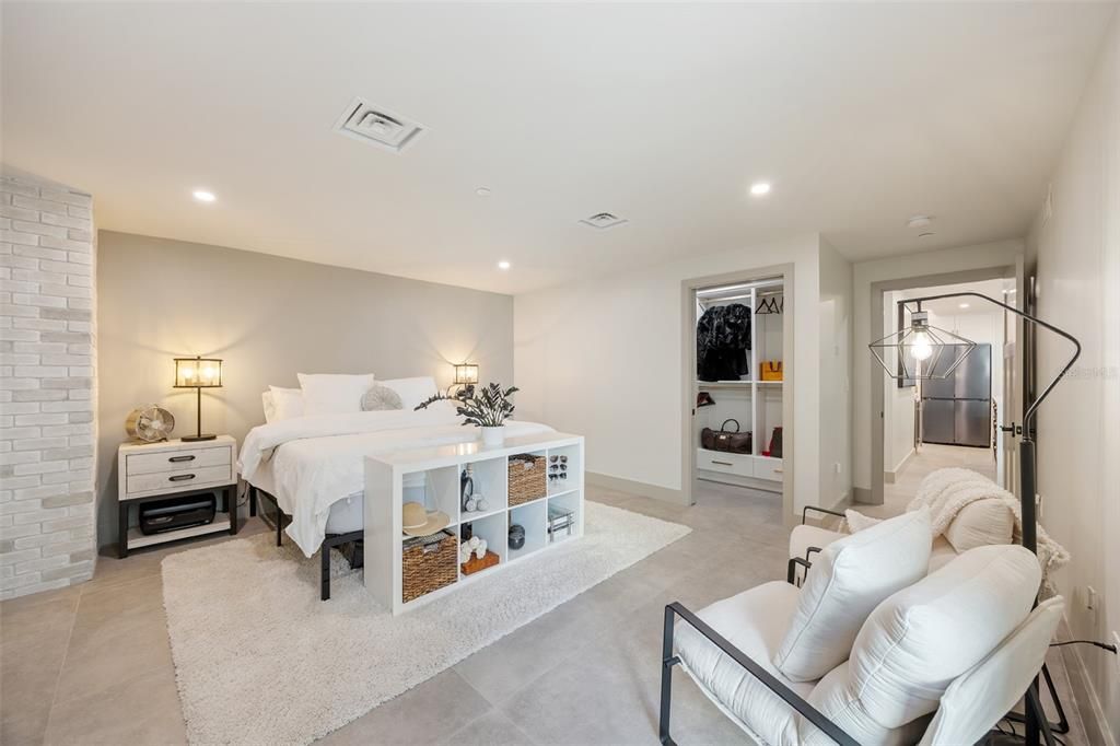 Exposed brickwork detail and walk-in closet