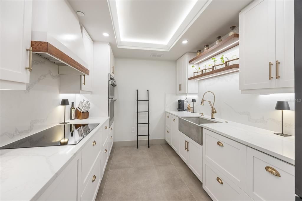 Designer kitchen with soft close underlit cabinets, tray ceiling, all new appliances