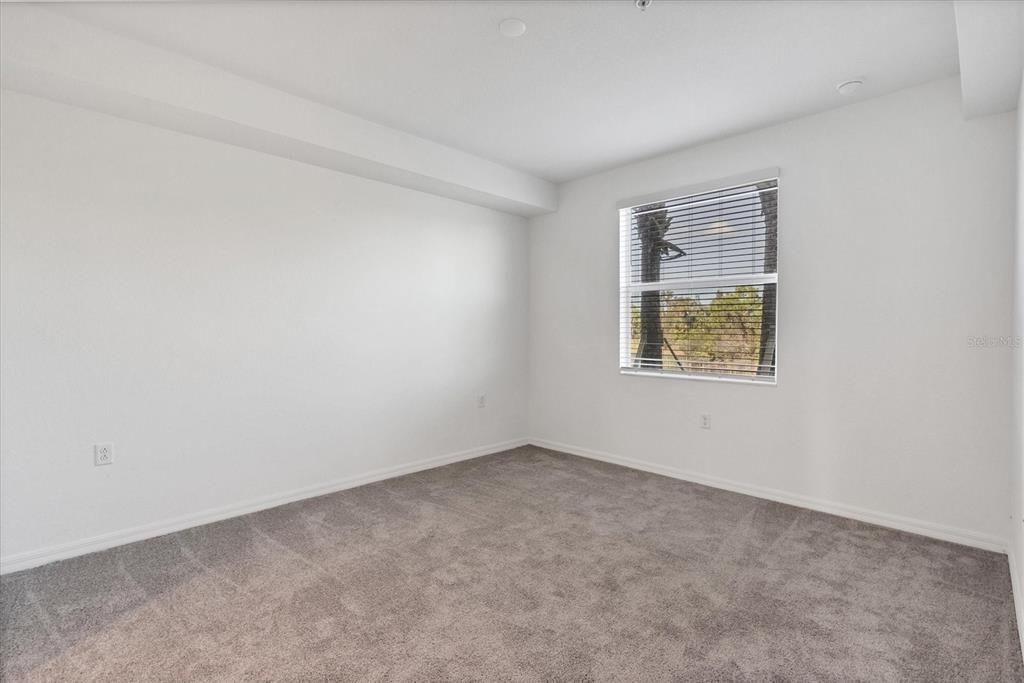 Bedroom 1, with view of lake and preserve