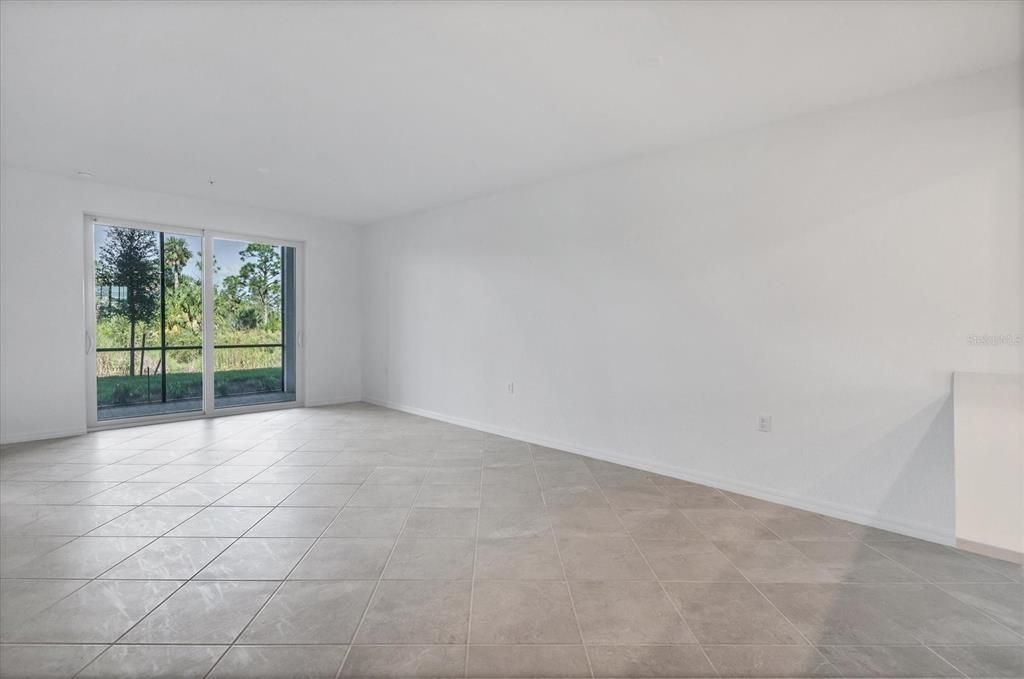 Living area facing Lanai with view of lake and preserve