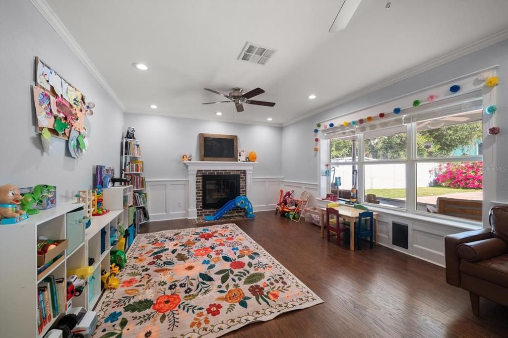 Family room is spacious and has abundant natural light