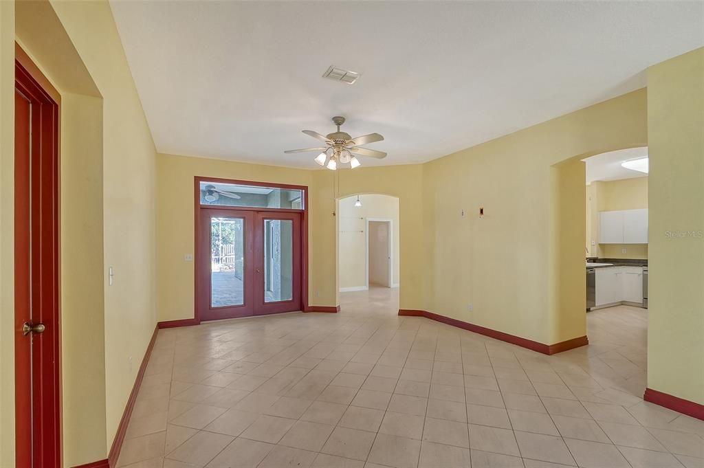 Formal living room with vies of the lanai and pool