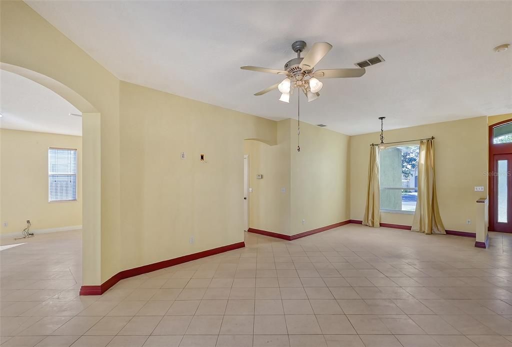 Living room and dining room lead to the kitchen and family room