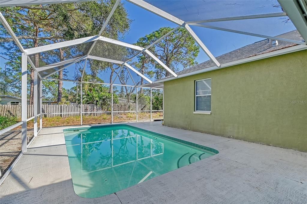 Private pool area with screened enclosure