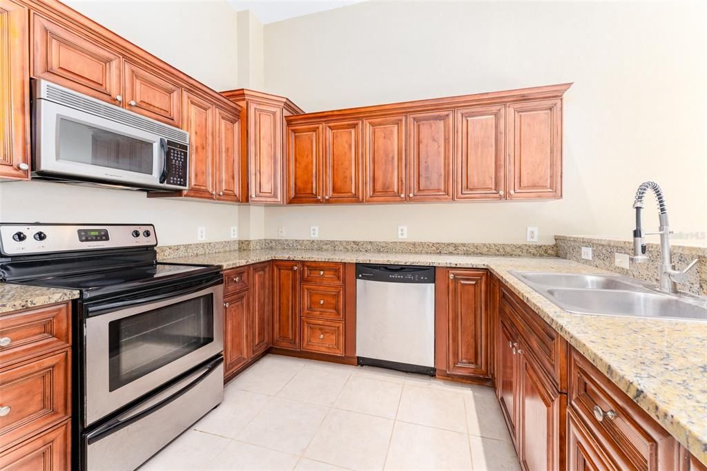 Gorgeous kitchen with stainless steel appliances and granite countertops!