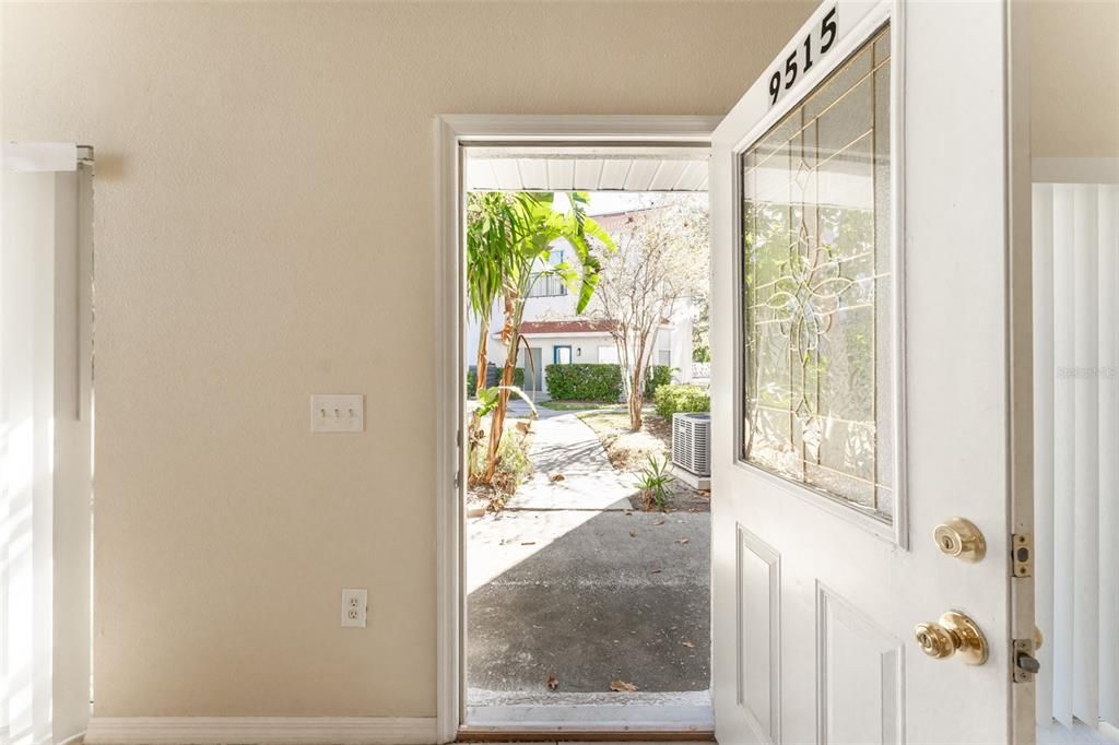 Door in between the two sliding glass doors in the living room.