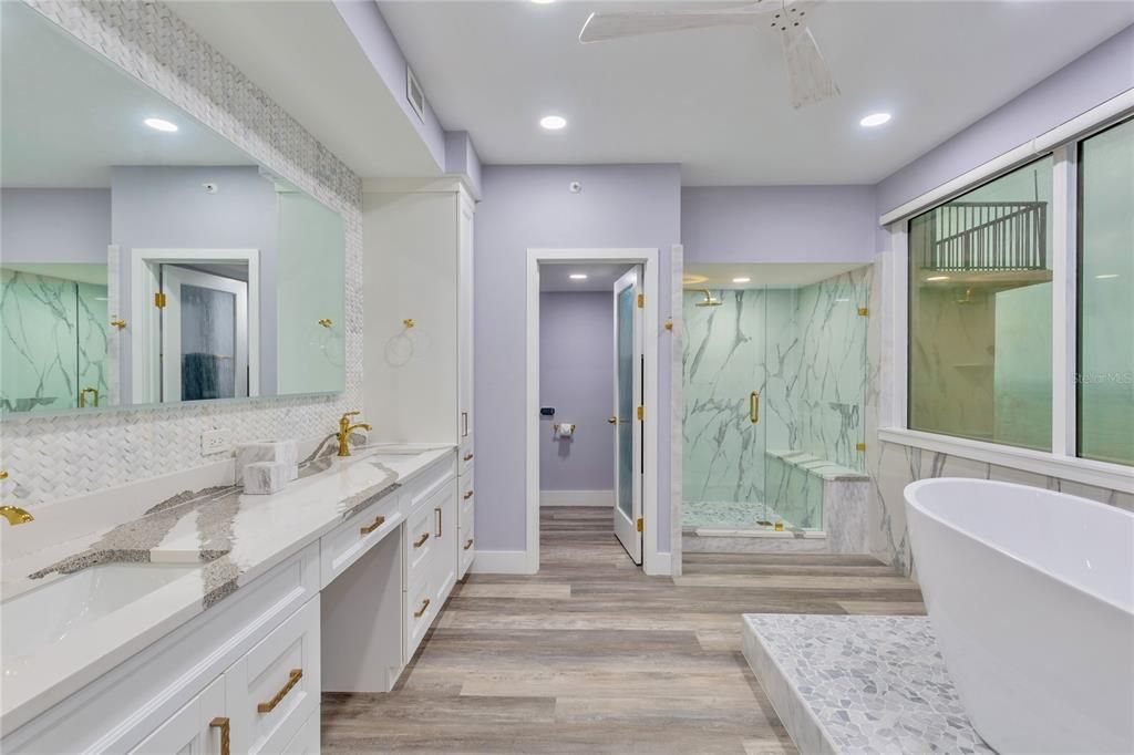 Large double vanities and an LED mirror.